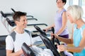 Fitness young people on treadmill cardio workout