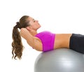 Fitness young woman doing abdominal crunch on fitness ball Royalty Free Stock Photo