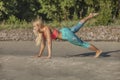 Young woman doing push ups on beach Royalty Free Stock Photo