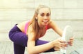 Fitness young woman doing stretching warming up in the city, female athlete doing sports outdoors Royalty Free Stock Photo