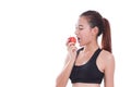 Fitness young woman eating apple. Royalty Free Stock Photo