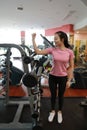 Asian chinese Fitness young woman on gym Display the muscles Royalty Free Stock Photo