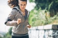 Fitness young woman jogging in the city park Royalty Free Stock Photo
