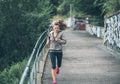 Fitness young woman jogging in the city park Royalty Free Stock Photo