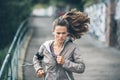 Fitness young woman jogging in the city park Royalty Free Stock Photo