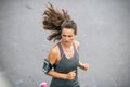 Fitness young woman jogging outdoors in the city Royalty Free Stock Photo