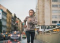 Fitness young woman jogging in rainy city Royalty Free Stock Photo