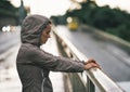 Fitness young woman in rainy city