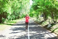 Fitness young woman running in summer park, female runner workout - sport and healthy lifestyle Royalty Free Stock Photo