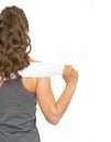 Fitness young woman with towel. rear view Royalty Free Stock Photo