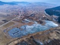 Aerial view, small frozen lake near the village. Royalty Free Stock Photo