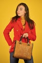 Fits perfect. Beauty brunette. Fashionable woman in jacket. Fashion autumn winter. female trendy beauty. handbag and Royalty Free Stock Photo