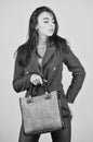 Fits perfect. Beauty brunette. Fashionable woman in jacket. Fashion autumn winter. female trendy beauty. handbag and Royalty Free Stock Photo