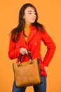 Fits perfect. Beauty brunette. Fashionable woman in jacket. Fashion autumn winter. female trendy beauty. handbag and Royalty Free Stock Photo