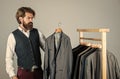 Fits perfect. Man clothing in boutique. Man with suit. tailor in his workshop. Handsome bearded fashion man in classical Royalty Free Stock Photo