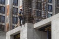 Fitters-fitters-high-altitude workers on the assembly frame of the building