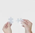 Fitting the pieces together. A business concept image of puzzle pieces fitting together - closeup. Royalty Free Stock Photo