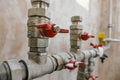 Fittings and valve, pipes and adapters. Plumbing fixtures and piping parts. focus on the red crane Royalty Free Stock Photo