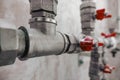 Fittings and valve, pipes and adapters. Plumbing fixtures and piping parts. focus on the red crane Royalty Free Stock Photo