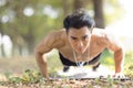 Fittness asian  man doing exercises in the park Royalty Free Stock Photo