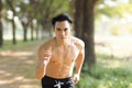 Fittness asian  man doing exercises in the park Royalty Free Stock Photo