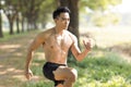 Fittness asian Young man doing exercises in the park