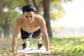 Fittness asian Young man doing exercises in the park