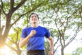 Fittness Young man jogging in the city park Royalty Free Stock Photo