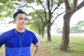 Fittness Young man jogging in the city park