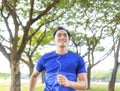 Fittness Young man jogging in the park Royalty Free Stock Photo