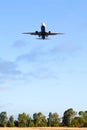 Fiumicino, Italy. Bottom view of airplane flying above the fields near airport Rome-Fiumicino Royalty Free Stock Photo