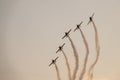 Five airplanes in formation on airshow. Aerobatic team performs flight at air show