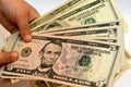 Five 5 American dollars banknote money bill in the hand of a young child features profile of a portrait of Abraham Lincoln, the Royalty Free Stock Photo