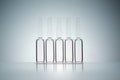 Five ampoules in a row. Conceptual image