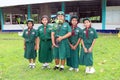 Five Asian students stand in low.