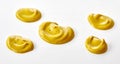 Assorted decorative twists of yellow mustard