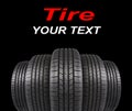 Five automobile rubber tires isolated on black