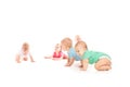 Group of eight babies, crawling, over white