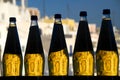 Five Backlit Bottles with Amber Liquid