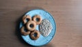 Five baked donut shaped Medhu Vada, Chili Pakora with Coconut Chutney.Delicious south Indian cuisine on a white plate against