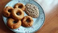 Five baked donut shaped Medhu Vada, Chili Pakora with Coconut Chutney.Delicious south Indian cuisine on a white plate against