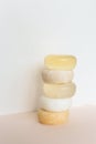 Five bars of natural handmade translucent soap in white background.