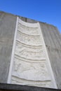 The five bas-reliefs on the Arizonaelevator tower, done in concrete, show the visages of those Indian tribes who have inhabited