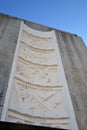 The five bas-reliefs on the Nevada elevator tower, done in concrete, show the multipurpose benefits of Hoover Dam: flood control,