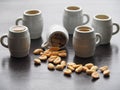 Five beer mugs and one mug with salted peanuts