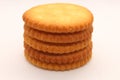 five biscuits stacked on a white background.