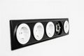 Five black white sockets in the white wall Royalty Free Stock Photo