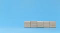 Five blank wooden cube block stack on blue background with copy space for input text and icon Royalty Free Stock Photo