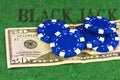 Five blue chips lie on a bill fifty dollars Royalty Free Stock Photo