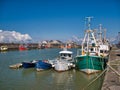 Five boats in decreasing size moored at Maryport on the Solway Coast in Cumbria, UK.